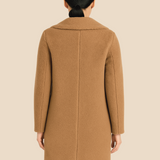 Blød teddy damefrakke i lang model med elegant krave