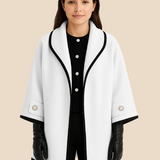 Elegant dameponcho i uldlook med knapdetaljer og løs pasform