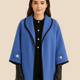 Elegant dameponcho i uldlook med knapdetaljer og løs pasform