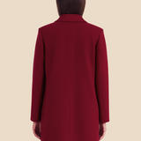 Stilren dobbeltradet damefrakke i uldlook med moderne pasform