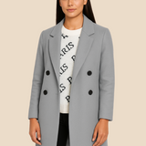 Stilren dobbeltradet damefrakke i uldlook med moderne pasform