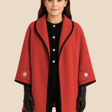 Elegant dameponcho i uldlook med knapdetaljer og løs pasform