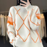 Oversized striktrøje med orange rudemønster og ribkanter