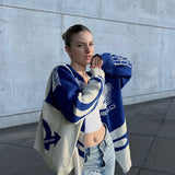 Oversized striktrøje med grafisk mønster og sporty look