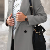 Elegant dobbeltknappet damefrakke med klassisk pasform