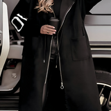 Lang teddyfrakke med hætte og statement-ærmer – varm og trendy