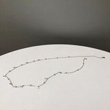 Sølv choker halskæde med små perler – minimalistisk og elegant design