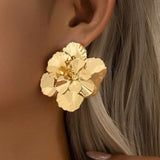 Store guld blomsterøreringe til kvinder – luksuriøst og elegant design