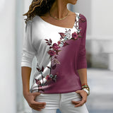 Elegant bluse med blomsterprint og asymmetrisk hals – Trekvartærmer