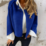 Elegant poncho-cardigan med knaplukning – blød og stilfuld