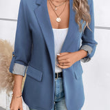 Elegant dame blazer med opfoldede ærmer og lommedetaljer
