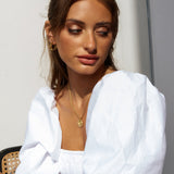 Guld snoede hoop øreringe til kvinder – elegant og tidløst design