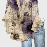 Let Bluse med Blomstermotiv og Flæseærmer – Feminin Stil med Kunstnerisk Udtryk