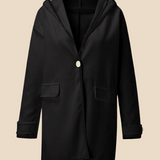 Elegant dameponcho i uldlook med knapdetaljer og løs pasform