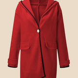 Elegant dameponcho i uldlook med knapdetaljer og løs pasform