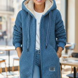 Varm teddyjakke med hætte og afslappet pasform – blød komfort til kolde dage