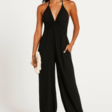 Halterneck dame jumpsuit med dyb udskæring og elastiske ben