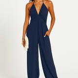 Halterneck dame jumpsuit med dyb udskæring og elastiske ben