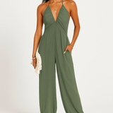 Halterneck dame jumpsuit med dyb udskæring og elastiske ben