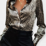 Elegant bluse med eksklusivt print og V-udskæring – feminin stil med luksuriøst udtryk