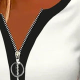 Bluse med lynlås i halsen og sporty detaljer – afslappet elegance til hverdagen