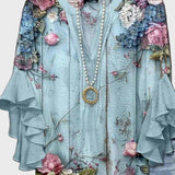Let Bluse med Blomstermotiv og Flæseærmer – Feminin Komfort i Løs Pasform