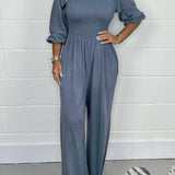 Smocket jumpsuit med firkantet hals og puffærmer