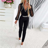 Slim jumpsuit med glimmerærmer og rhinestone V-udskæring