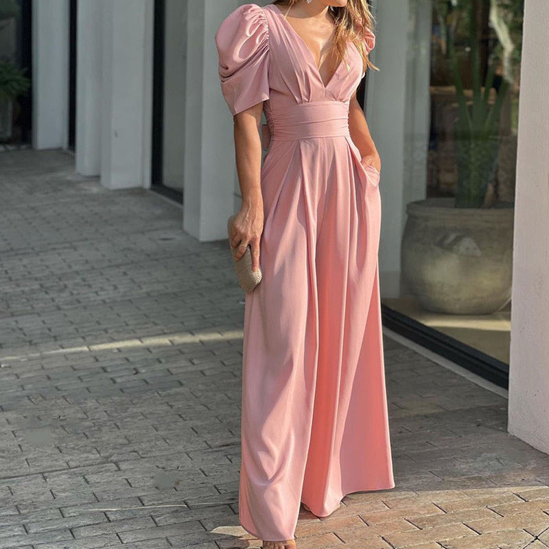 Elegant dame jumpsuit med pufærmer og v-udskæring