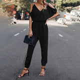 Cold shoulder jumpsuit med V-udskæring og elastisk talje
