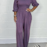 Smocket jumpsuit med firkantet hals og puffærmer