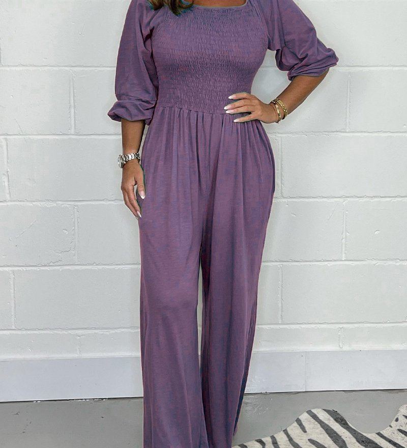 Smocket jumpsuit med firkantet hals og puffærmer