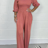 Smocket jumpsuit med firkantet hals og puffærmer