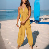 Halterneck dame jumpsuit med dyb udskæring og elastiske ben