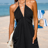 Halterneck dame jumpsuit med dyb udskæring og elastiske ben