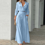 Elegant slå-om jumpsuit med lange ærmer og bindebælte