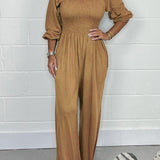 Smocket jumpsuit med firkantet hals og puffærmer