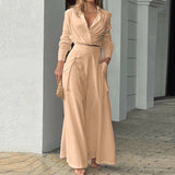 Elegant slå-om jumpsuit med lange ærmer og bindebælte