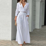 Elegant slå-om jumpsuit med lange ærmer og bindebælte