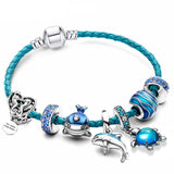 Charm Armbånd med Blå Havtema Perler og Delfin Vedhæng