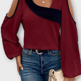Asymmetrisk bluse med åbne skuldre og moderne snit – feminin stil med kant