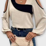 Asymmetrisk bluse med åbne skuldre og moderne snit – feminin stil med kant
