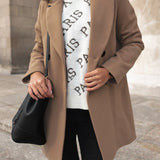 Elegant dobbeltknappet damefrakke med klassisk pasform