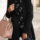 Elegant dobbeltknappet damefrakke med klassisk pasform