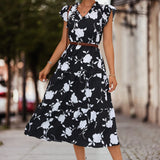 Sommerkjole med Blå Blomsterprint og Flæseærmer – Elegant A-snit