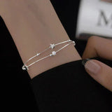 Tyndt Sølv Armbånd med Stjernevedhæng og Minimalistisk Design