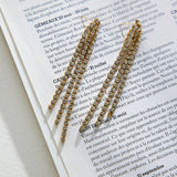 Lange rhinsten øreringe til kvinder – glamourøst og festligt design