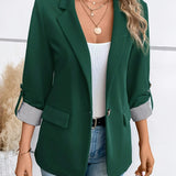 Elegant dame blazer med opfoldede ærmer og lommedetaljer