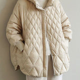 Vatteret quiltet jakke med hætte – varm komfort og moderne hverdagsstil
