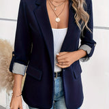 Elegant dame blazer med opfoldede ærmer og lommedetaljer